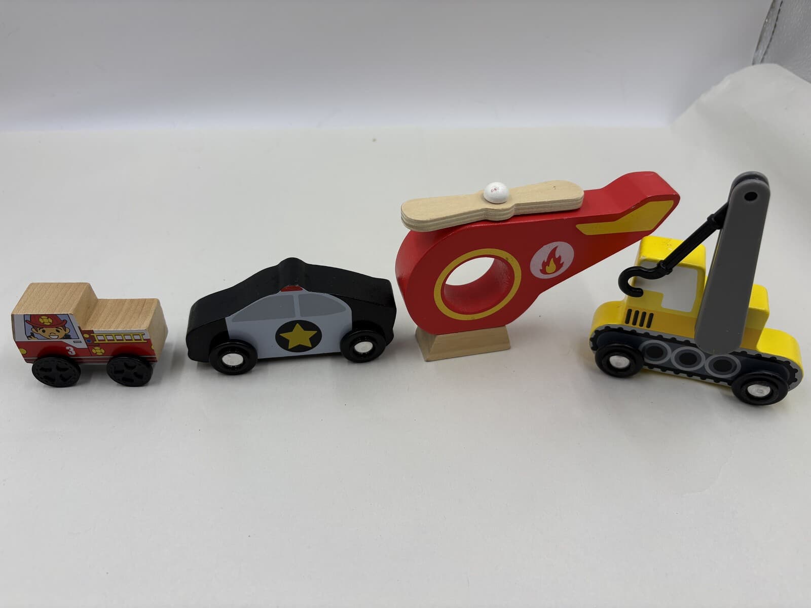 B. Toys Wood & Wheels Wooden Vehicle Lot of 4 Fire Police Helicopter Excavator