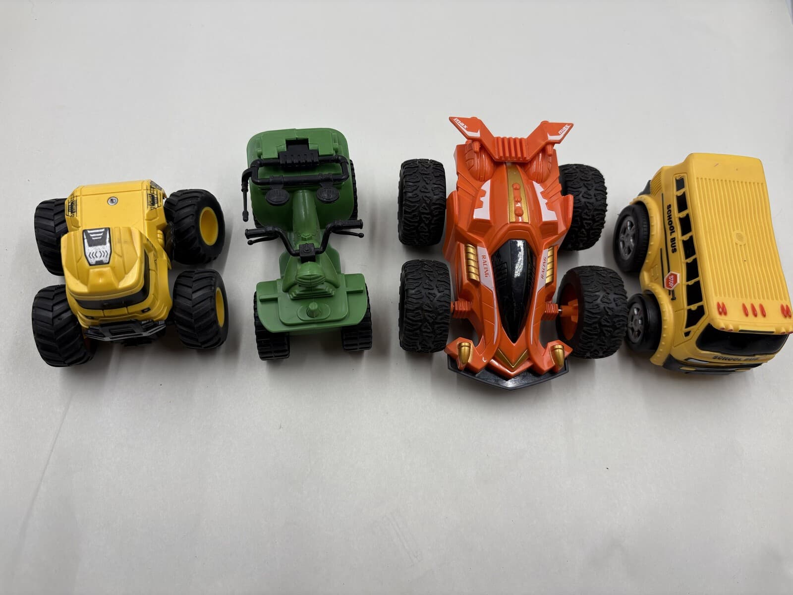 Lot of 4 Plastic Toy Vehicles Monster Truck Race Car School Bus Trike
